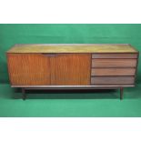 Teak sideboard having two doors and four reeded drawers, standing on tapering legs (possibly Danish,