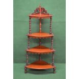 Mahogany graduated four tier corner what-not having raised fretwork top,