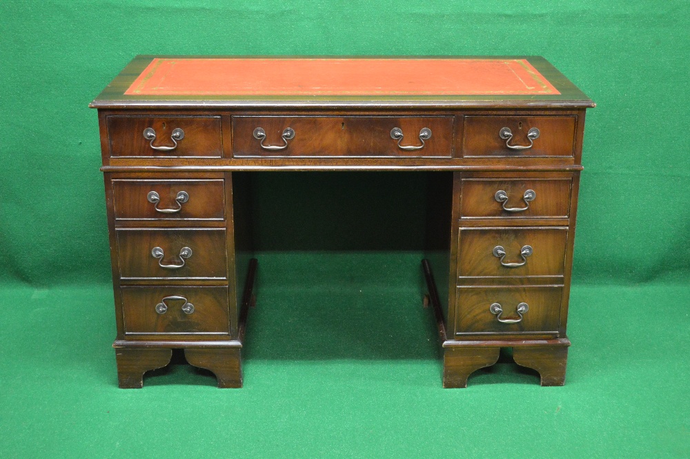 20th century mahogany pedestal desk with red leather insert over three drawers and three further