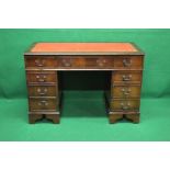 20th century mahogany pedestal desk with red leather insert over three drawers and three further