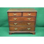 A Georgian mahogany chest of two short and three long graduated drawers with brass handles and