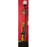 Skeleton petrol pump finished in yellow and black with hose and nozzle,