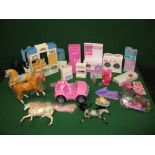 Barbie, a quantity of buildings and accessories for Barbie dolls to include a car, stables,