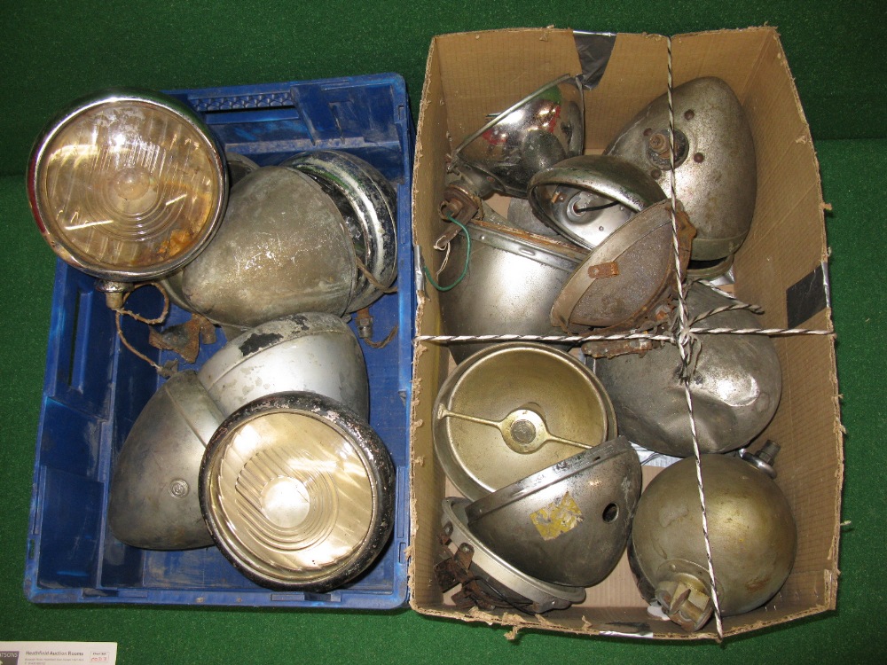 Two boxes of large headlamp bowls together with a quantity of glass,