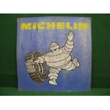 Aluminium advertising sign for Michelin featuring Bibendum rolling a tyre,