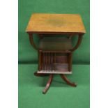 Edwardian oak revolving book table the top supported by four sweeping uprights leading to lower