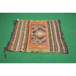 Brown ground rug with red,