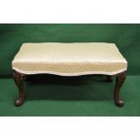 Victorian footstool having overstuffed padded top supported on carved cabriole legs - 29" long