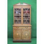 Inlaid and cross banded mahogany glazed bookcase having pair of glazed doors over single drawer and