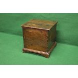 Georgian oak commode the top lifting to reveal a ceramic bucket with wooden lid,