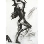 A framed charcoal sketch of a nude woman