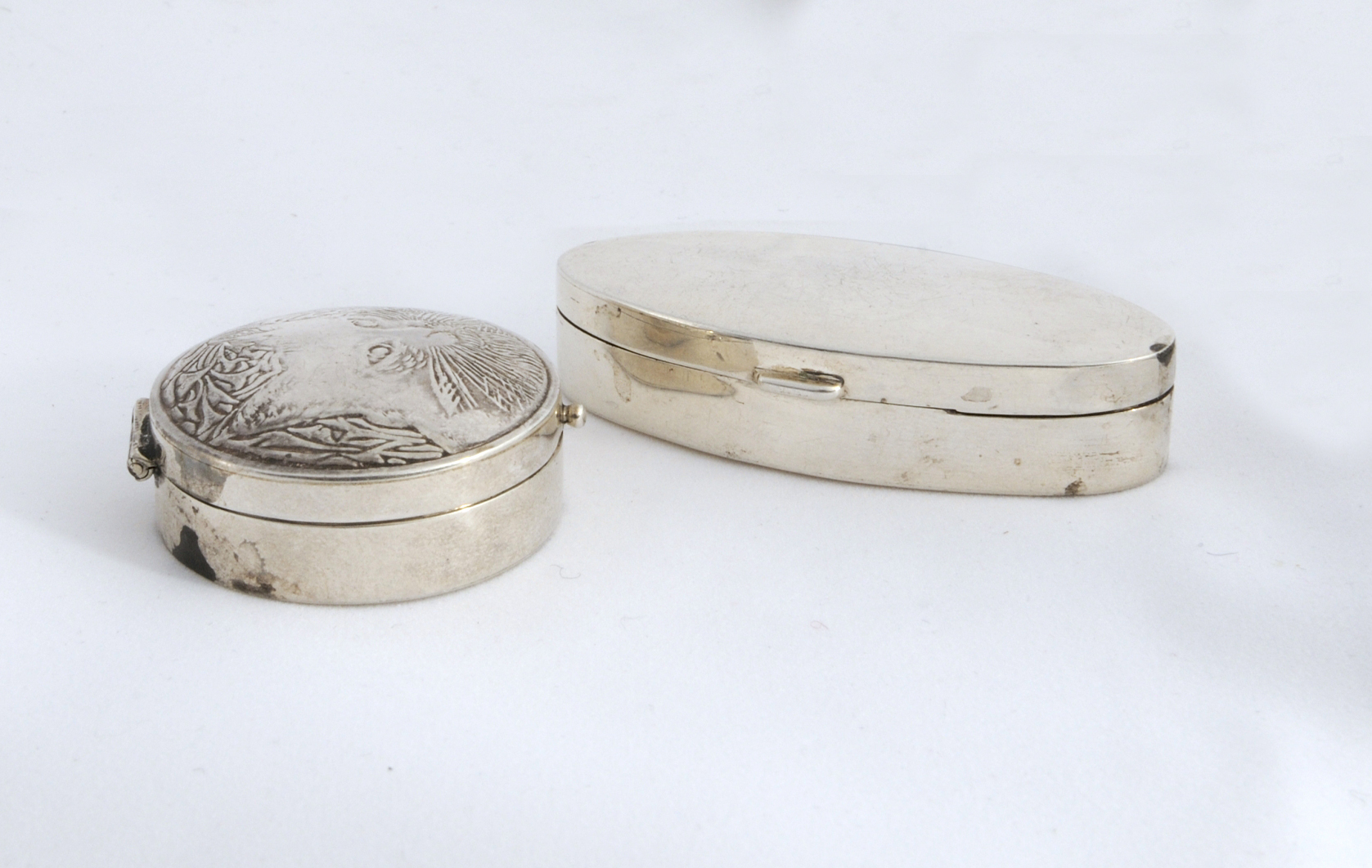 Two Silver Pill Boxes.