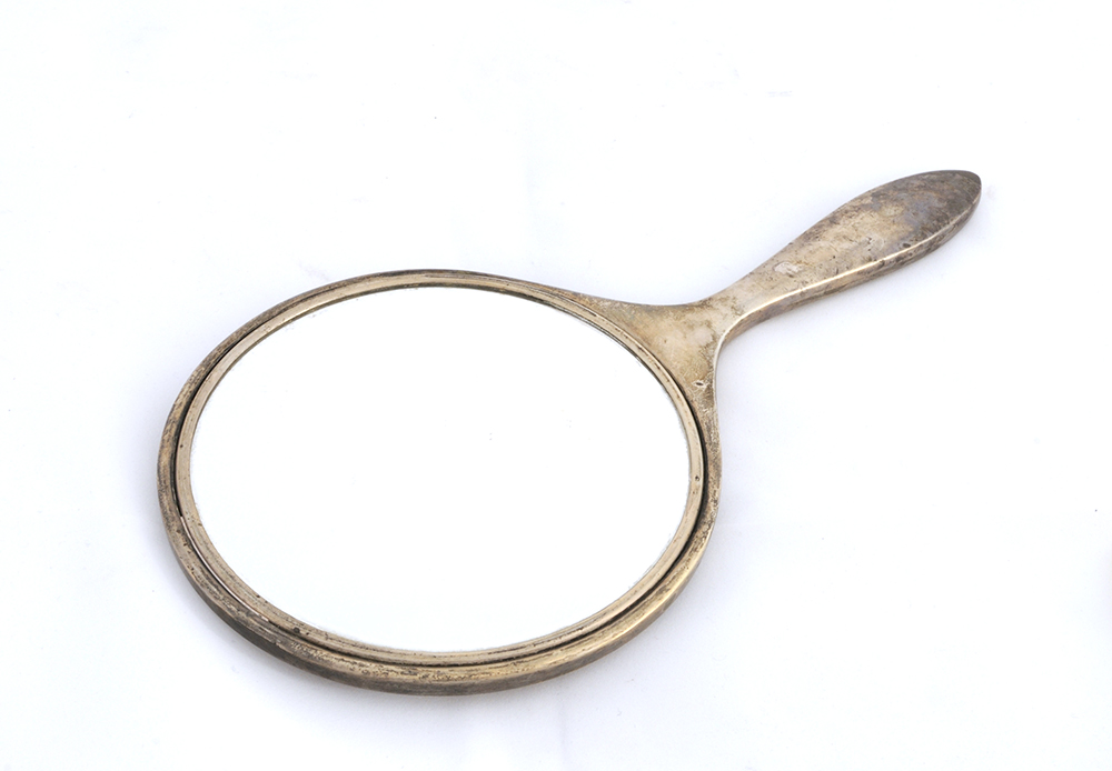 A Ladies Silver Plate Hand Mirror initia