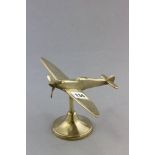 A Brass Model of a Spitfire on stand