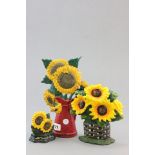 Three cast iron Doorstops with Sunflowers