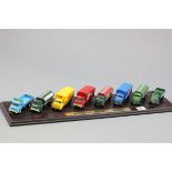 Eight Diecast Toy Trucks being Classic British Trucks of the 1950's mounted on wooden stand