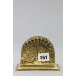 A Brass Stationery Rack with pierced brass fan panels