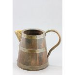 A Large Oak Brass Bound Jug