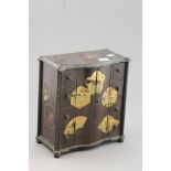 A Small Japanese Table Cabinet with fir cone handles to drawers behind a pair of doors