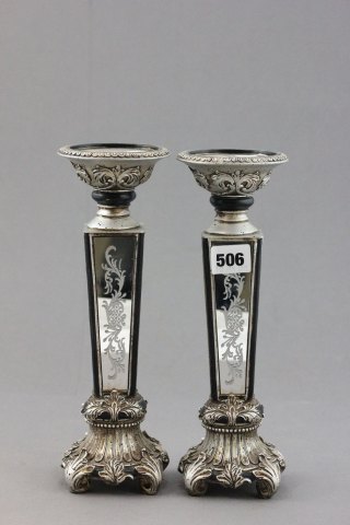 A Pair of Silvered Candlesticks with mirror panels