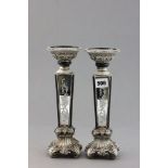 A Pair of Silvered Candlesticks with mirror panels