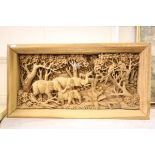 A Carved Wooden Thai Panel depicting Elephants and Wildlife