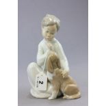 A Lladro Figure Group of Boy and Dog