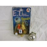 Two ET collectables including carded Elliott & ET on bike figure