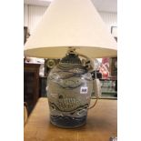 A Pottery Lamp Base decorated with fish and sea birds