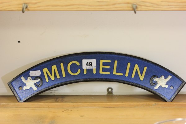 A Cast Iron Arched 'Michelin' Sign