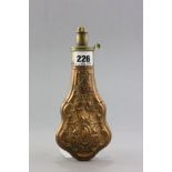 A 19th century Copper and Brass Powder Flask with strap work embossed decoration