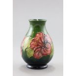 A Moorcroft 'Hibiscus' Vase on green ground