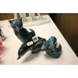 A Poole Pottery Blue Glazed Cat, Otter and Dolphin