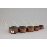 Set of Five Graduating Copper and Brass Saucepans