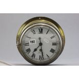 A Brass Ships Bulkhead Clock, the white enamel face marked Smiths, Cricklewood W.2 with a start/