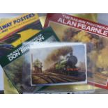 Three books relating to the railways and a file with train prints