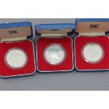 Three boxed silver Crowns