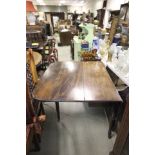 19th century Mahogany Drop Flap Dining Table on slender turned legs and castors
