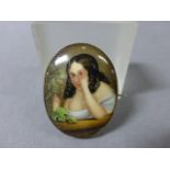 Late 19th century Gilt Mounted Oval Porcelain Brooch depicting a maiden looking through her fingers