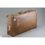 Vintage Leather Suitcase with various travel stickers including Southern Railways, Charing Cross,