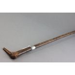 Walking Stick with handle carved in the form of a duck head, with silver? band