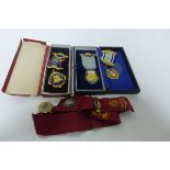 Two Cased Gilt and Enamel Masonic Medals with Ribbons together with another uncased plus Gilt &