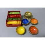 Set of Brass Tiddly wink Cups with coloured bowls together with a Box of Tiddly Winks