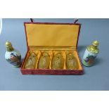 Two Ceramic Erotic Scent Bottles and a Cased Set of Four Inside Painted Glass Snuff Bottles