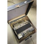 Cased Hohner Double Ray Accordian