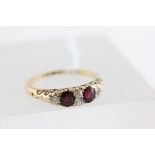 18ct Yellow Gold Ring set with two oval rubies and four diamonds