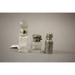 Three Victorian Glass and Silver Topped Scent Bottles