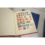 Two stamp albums with a quantity of world used stamps hinged plus a brown envelope of franked