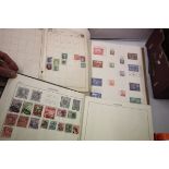 Three stamp albums containing of the world mint and used hinged