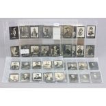 Approximately 77 Ogdens Guinea Gold cigarette cards